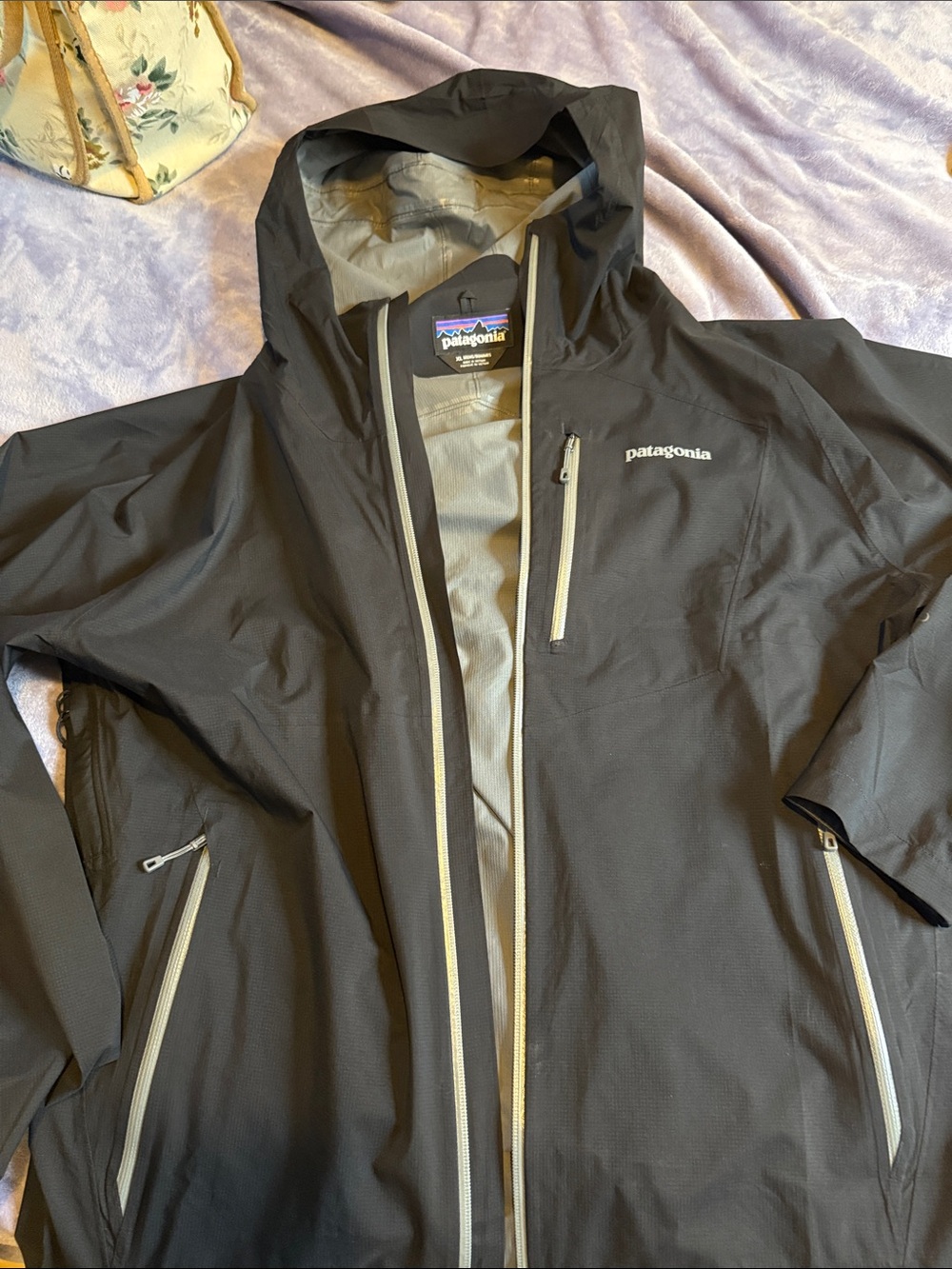 Patagonia Men’s Black Hooded Raincoat with Light Gray Zippers